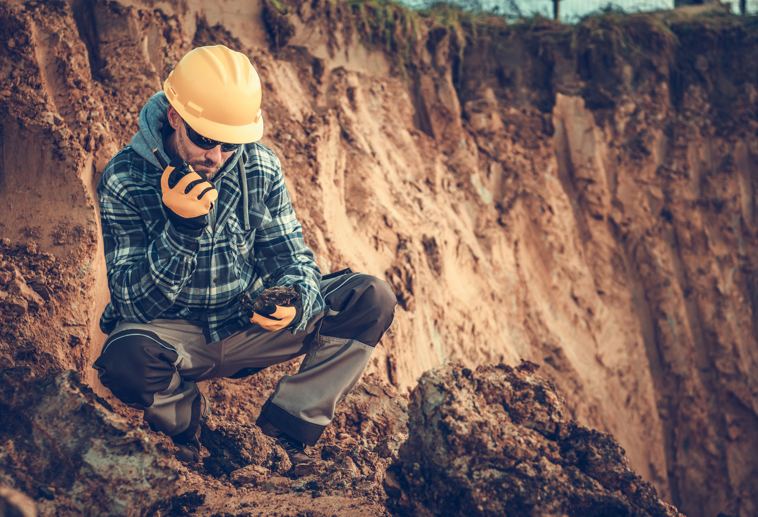 Caucasian Male Engineering Geologist Talking On Radio At Construction Site. US 45 Bypass-Saline, Gallatin & White Counties, IL